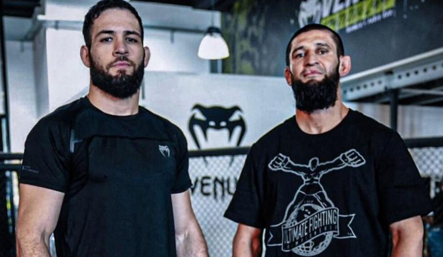 Nassourdine Imavov and Khamzat Chimaev stand face-to-face in training gear, symbolizing the intensifying UFC middleweight title race as Dana White seeks the next top contender.
