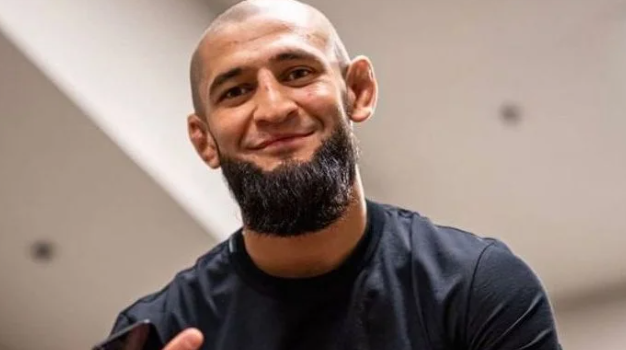 Khamzat Chimaev smiling in a candid moment, representing his dominant yet debated fighting style that split MMA fans and impressed contenders like Imavov.
