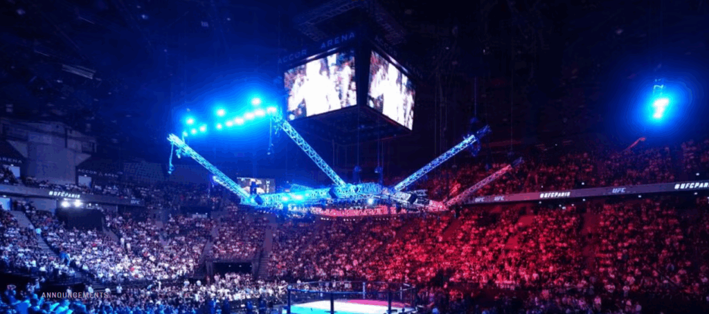 A packed Accor Arena in Paris illuminated in blue and red lighting during a UFC event, capturing the electrifying home atmosphere for Nassourdine Imavov ahead of his fight against Borralho.
